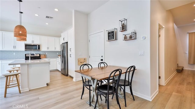 4173 Horvath St Unit 105, Corona, CA 92883 - dining area featuring recessed lighting and light wood-type flooring