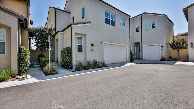 4173 Horvath St Unit 105, Corona, CA 92883 - townhome / multi-family property featuring stucco siding and an attached garage