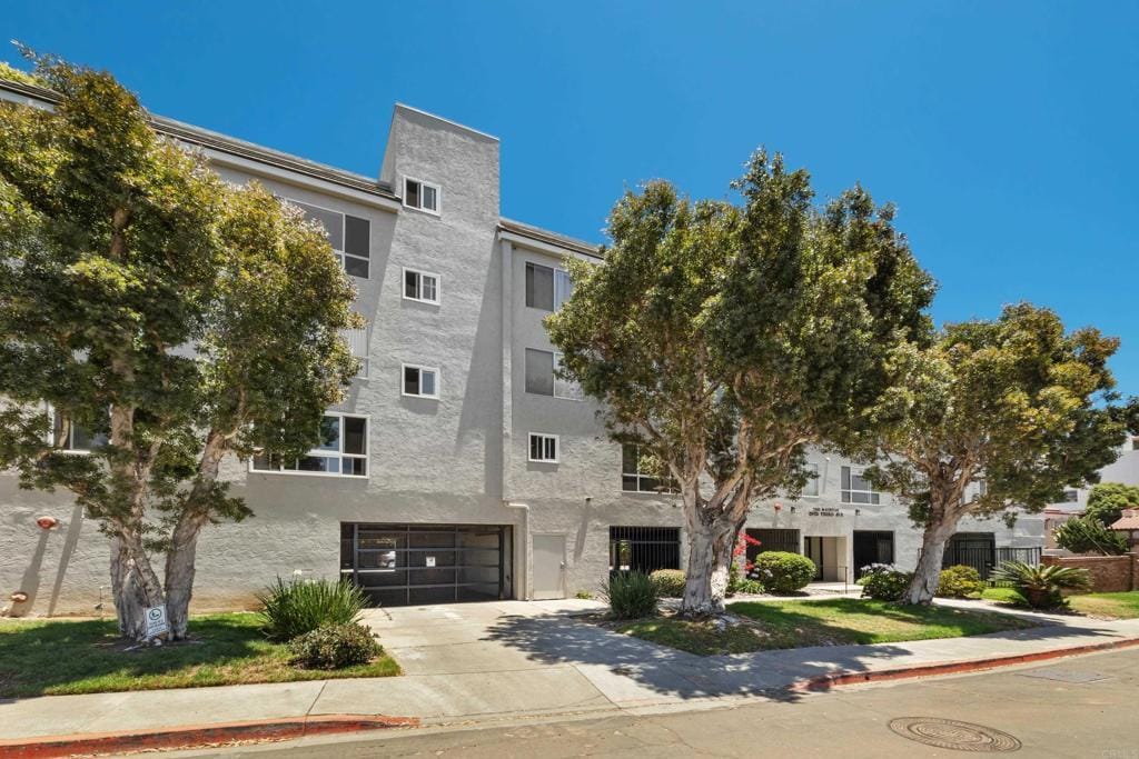 2825 3rd Ave Unit 303, San Diego, CA 92103 - view of property featuring concrete driveway and a garage