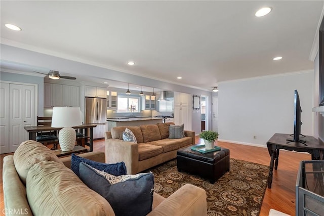 1827 Amelia Ave, San Pedro, CA 90731 - living area featuring light wood-type flooring, ornamental molding, recessed lighting, and ceiling fan