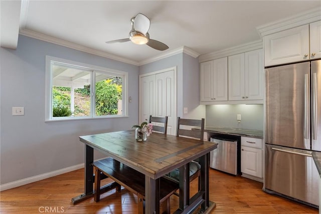 1827 Amelia Ave, San Pedro, CA 90731 - dining space featuring a ceiling fan, light wood-style floors, and ornamental molding