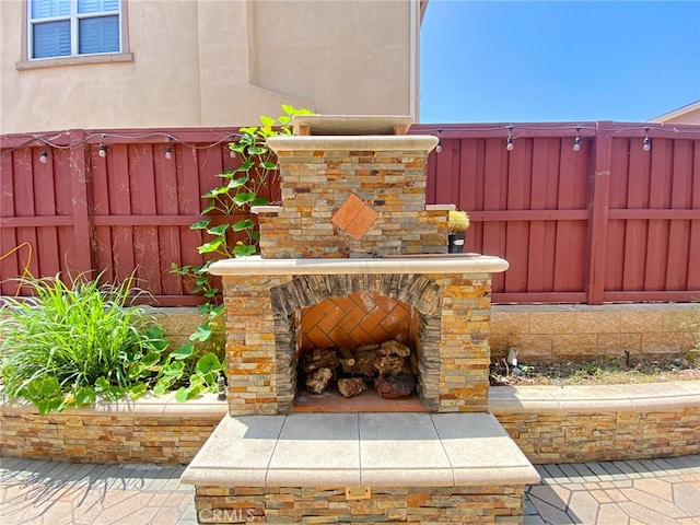 3318 Ridge Park Ct, Long Beach, CA 90804 - view of patio featuring an outdoor stone fireplace