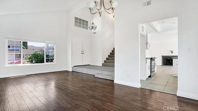 25866 Greenhill, Lake Forest, CA 92630 - foyer entrance featuring a chandelier, wood finished floors, stairway, and a towering ceiling