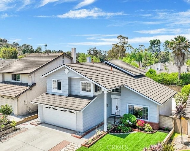 25866 Greenhill, Lake Forest, CA 92630 - traditional home featuring an attached garage, driveway, and a front yard