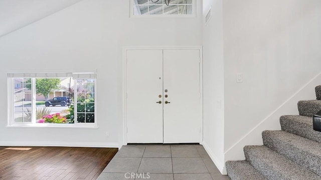 25866 Greenhill, Lake Forest, CA 92630 - entrance foyer featuring stairway, high vaulted ceiling, and hardwood / wood-style floors
