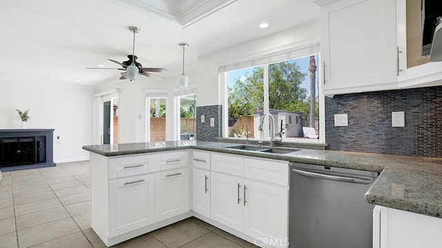 25866 Greenhill, Lake Forest, CA 92630 - kitchen featuring stainless steel dishwasher, a peninsula, light tile patterned floors, ceiling fan, and tasteful backsplash