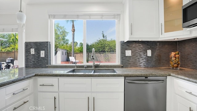 25866 Greenhill, Lake Forest, CA 92630 - kitchen featuring appliances with stainless steel finishes, white cabinetry, decorative backsplash, and stone countertops