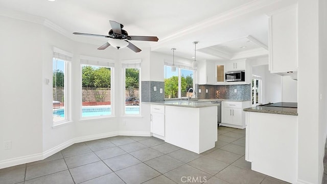 25866 Greenhill, Lake Forest, CA 92630 - kitchen featuring appliances with stainless steel finishes, a peninsula, white cabinets, backsplash, and light tile patterned floors