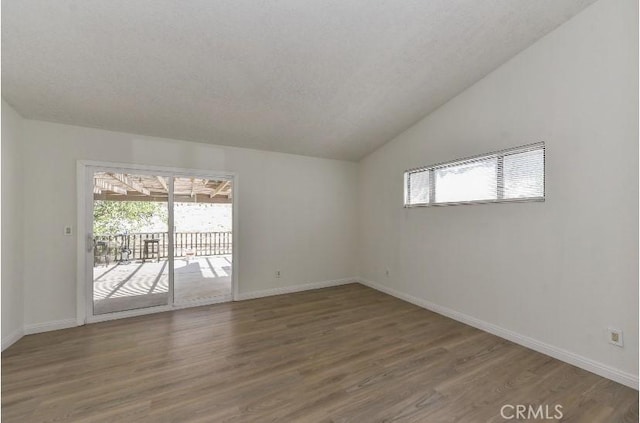 6318 Westview Dr, Riverside, CA 92506 - spare room featuring plenty of natural light, wood finished floors, and vaulted ceiling
