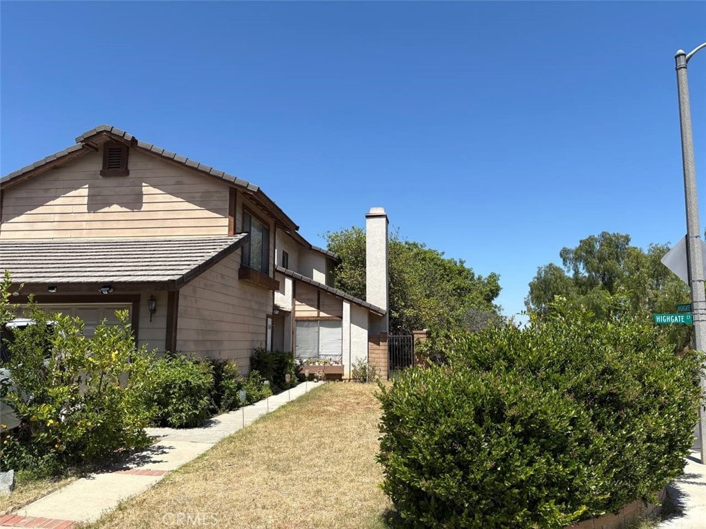 2598 Highgate Ct, Chino Hills, CA 91709 - view of side of property featuring a chimney