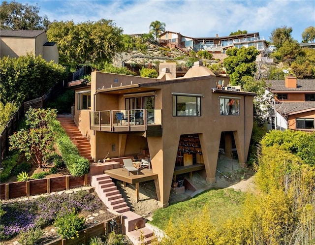 1372 Morningside Dr, Laguna Beach, CA 92651 - back of house featuring stairs, stucco siding, a wooden deck, and a chimney