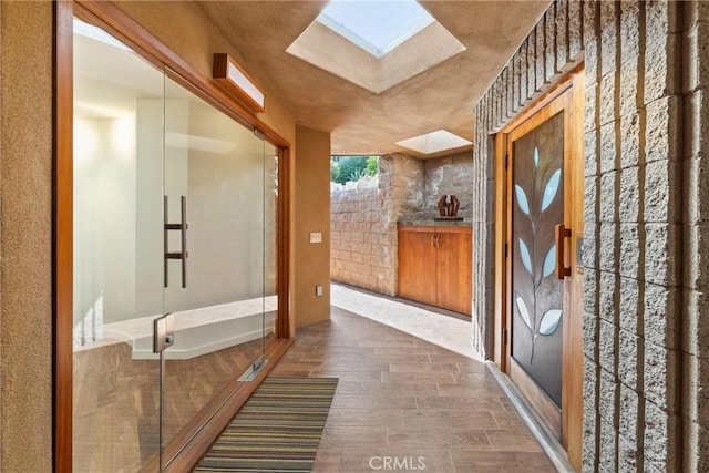 1372 Morningside Dr, Laguna Beach, CA 92651 - entrance foyer featuring a skylight and wood finished floors