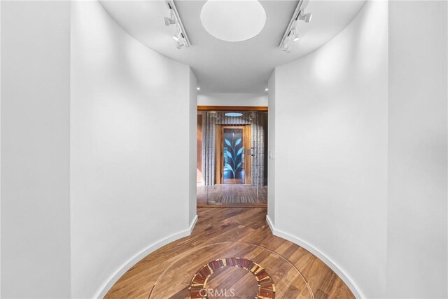 1372 Morningside Dr, Laguna Beach, CA 92651 - hallway with rail lighting and wood finished floors