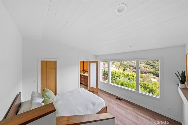 1372 Morningside Dr, Laguna Beach, CA 92651 - bedroom featuring light wood finished floors and ensuite bath