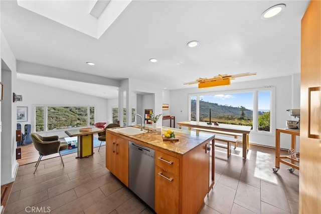 1372 Morningside Dr, Laguna Beach, CA 92651 - kitchen with stainless steel dishwasher, healthy amount of natural light, recessed lighting, a center island with sink, and brown cabinetry