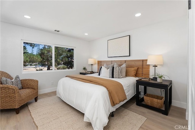 14941 Almond Grove Ct, Tustin, CA 92780 - bedroom with light wood-style flooring and recessed lighting
