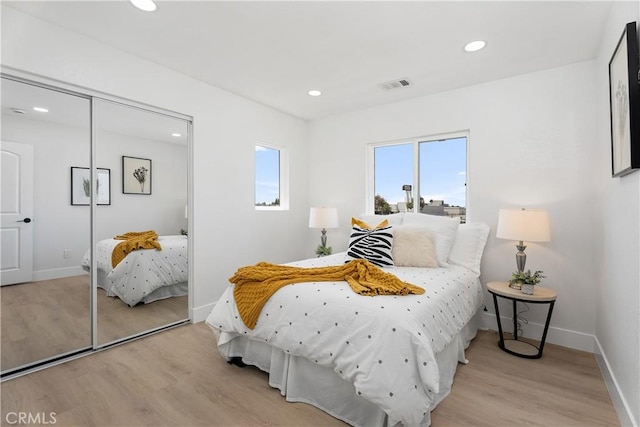 14941 Almond Grove Ct, Tustin, CA 92780 - bedroom featuring light wood-style floors and recessed lighting