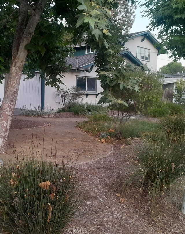 22654 Dolorosa St, Woodland Hills, CA 91367 - view of side of home featuring stucco siding