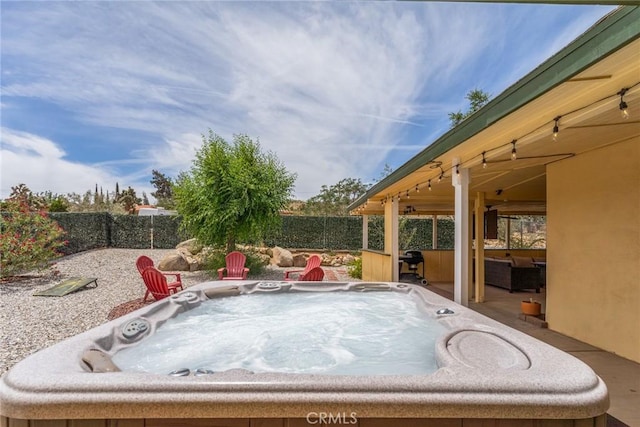 7787 Deer Trl, Yucca Valley, CA 92284 - fenced backyard featuring a hot tub and a grill
