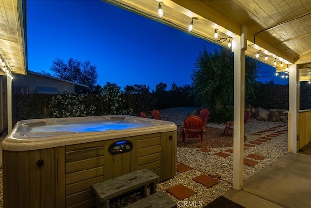 7787 Deer Trl, Yucca Valley, CA 92284 - patio at night featuring a hot tub