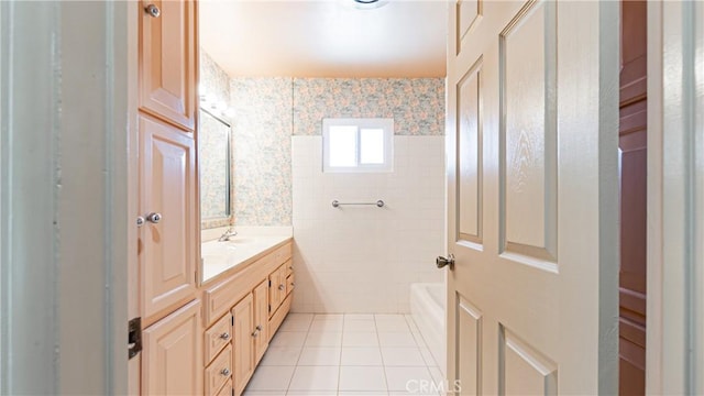 5449 E Fairbrook St, Long Beach, CA 90815 - bathroom with vanity, tile patterned flooring, tile walls, and a tub