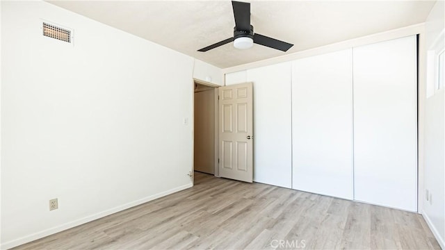 5449 E Fairbrook St, Long Beach, CA 90815 - unfurnished bedroom with light wood finished floors, a closet, and ceiling fan