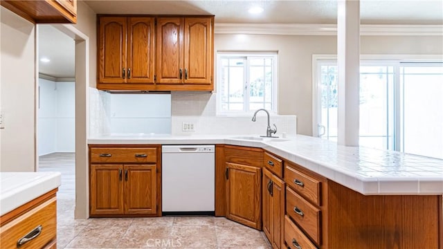 5449 E Fairbrook St, Long Beach, CA 90815 - kitchen featuring dishwasher, ornamental molding, brown cabinets, tile countertops, and backsplash