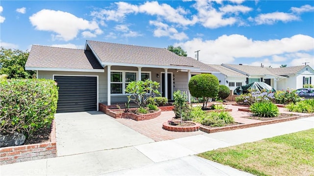 5449 E Fairbrook St, Long Beach, CA 90815 - ranch-style house with an attached garage, driveway, and a porch