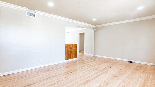 5449 E Fairbrook St, Long Beach, CA 90815 - empty room with arched walkways, ornamental molding, light wood-type flooring, and recessed lighting