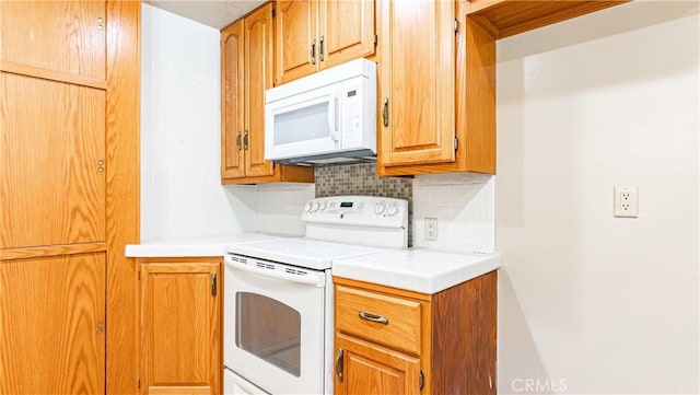 5449 E Fairbrook St, Long Beach, CA 90815 - kitchen with white appliances, tasteful backsplash, and light countertops