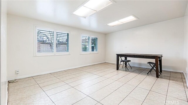 5449 E Fairbrook St, Long Beach, CA 90815 - empty room with light tile patterned floors and baseboards
