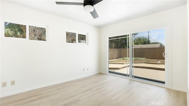 5449 E Fairbrook St, Long Beach, CA 90815 - unfurnished room with wood finished floors, plenty of natural light, and ceiling fan