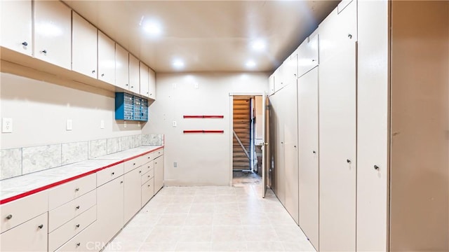 5449 E Fairbrook St, Long Beach, CA 90815 - kitchen featuring tile counters, white cabinets, and recessed lighting