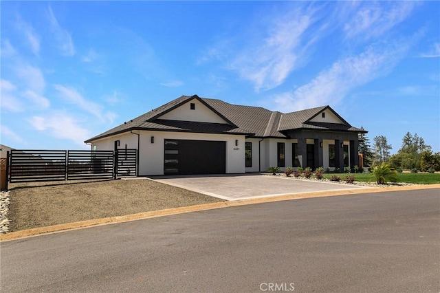5891 Crestmoor Dr, Paradise, CA 95969 - view of front facade featuring stucco siding, a garage, and driveway