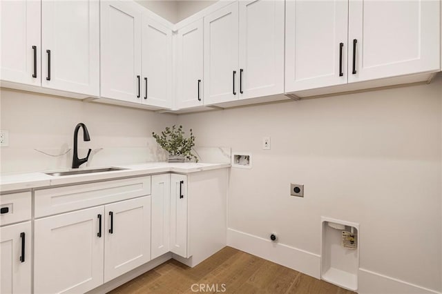 5891 Crestmoor Dr, Paradise, CA 95969 - laundry room with hookup for an electric dryer, hookup for a washing machine, cabinet space, and light wood-style floors