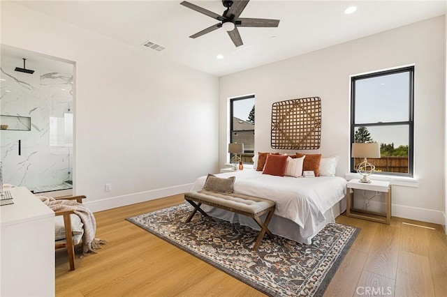 5891 Crestmoor Dr, Paradise, CA 95969 - bedroom with multiple windows, light wood-style floors, recessed lighting, and ensuite bath