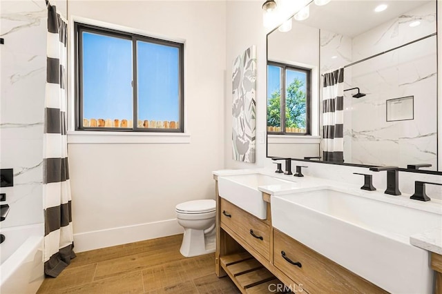 5891 Crestmoor Dr, Paradise, CA 95969 - full bath featuring double vanity, shower / bath combo with shower curtain, and wood finished floors