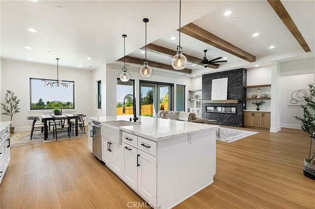 5891 Crestmoor Dr, Paradise, CA 95969 - kitchen featuring stainless steel dishwasher, a fireplace, a ceiling fan, recessed lighting, and light wood-style floors
