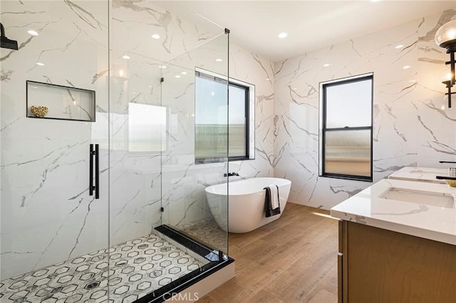 5891 Crestmoor Dr, Paradise, CA 95969 - bathroom with a marble finish shower, a freestanding bath, double vanity, wood finished floors, and recessed lighting