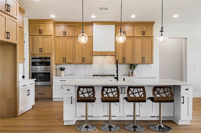 5891 Crestmoor Dr, Paradise, CA 95969 - kitchen with stainless steel double oven, light countertops, light wood-style floors, and recessed lighting