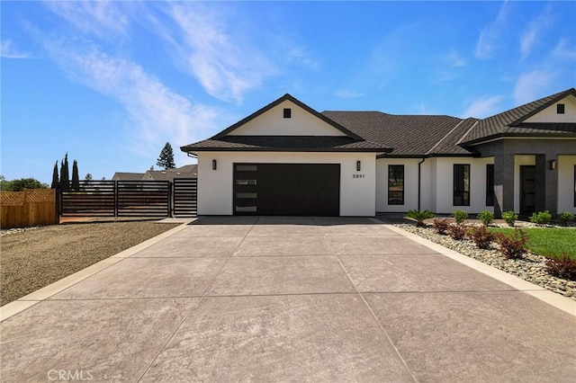 5891 Crestmoor Dr, Paradise, CA 95969 - view of front of home featuring stucco siding, driveway, an attached garage, and a gate