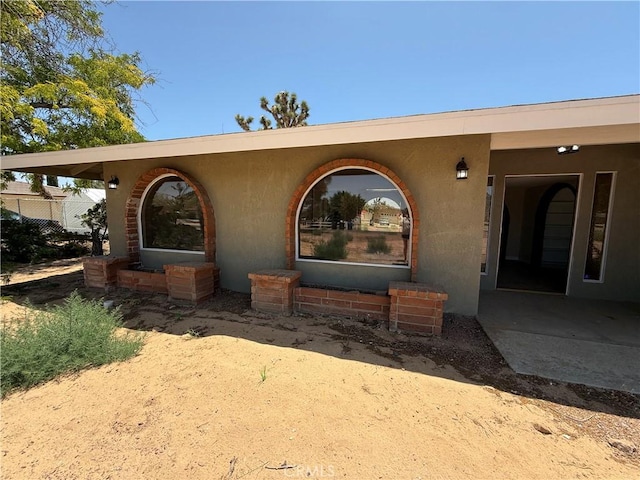 20219 Osseo Rd, Apple Valley, CA 92308 - doorway to property with stucco siding