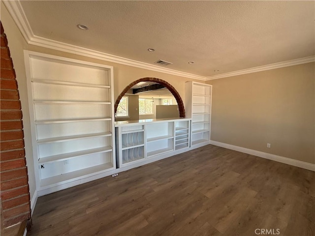 20219 Osseo Rd, Apple Valley, CA 92308 - unfurnished living room featuring a textured ceiling, dark wood finished floors, crown molding, recessed lighting, and built in shelves