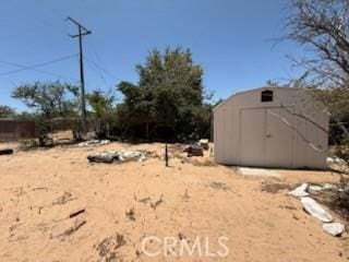 20219 Osseo Rd, Apple Valley, CA 92308 - view of yard featuring a shed