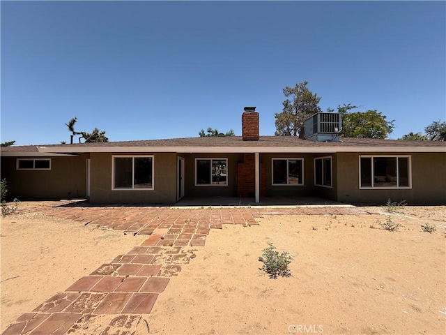 20219 Osseo Rd, Apple Valley, CA 92308 - back of property with a chimney and a patio