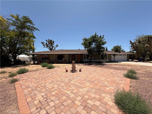 20219 Osseo Rd, Apple Valley, CA 92308 - ranch-style house featuring decorative driveway and a garage