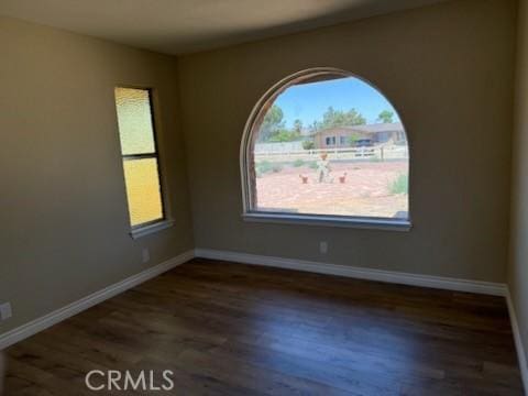 20219 Osseo Rd, Apple Valley, CA 92308 - empty room with wood finished floors and baseboards