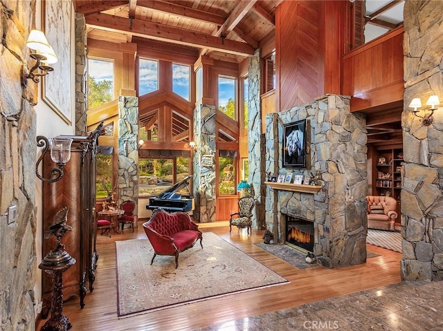 11485 Awenita Ct, Chatsworth, CA 91311 - sitting room featuring a stone fireplace, wooden ceiling, and hardwood / wood-style flooring