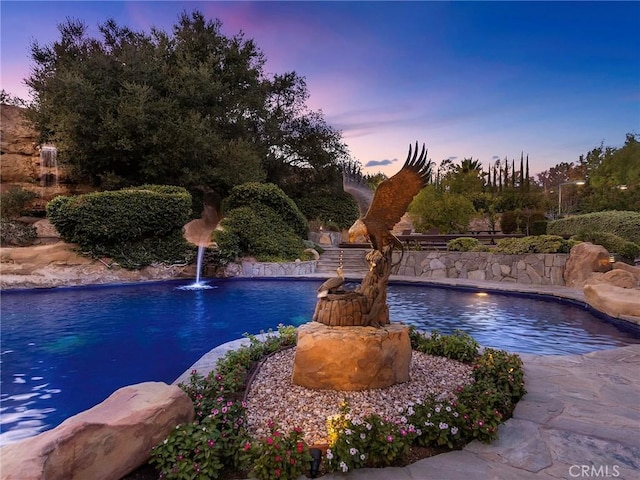 11485 Awenita Ct, Chatsworth, CA 91311 - pool at dusk featuring an outdoor pool
