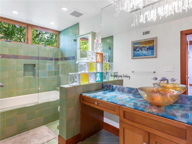 11485 Awenita Ct, Chatsworth, CA 91311 - bathroom with tile patterned flooring, tiled shower / bath combo, vanity, and recessed lighting